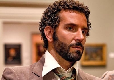 Bradley Cooper, showing how not to do the male perm in 'American Hustle'. Colombia Pictures