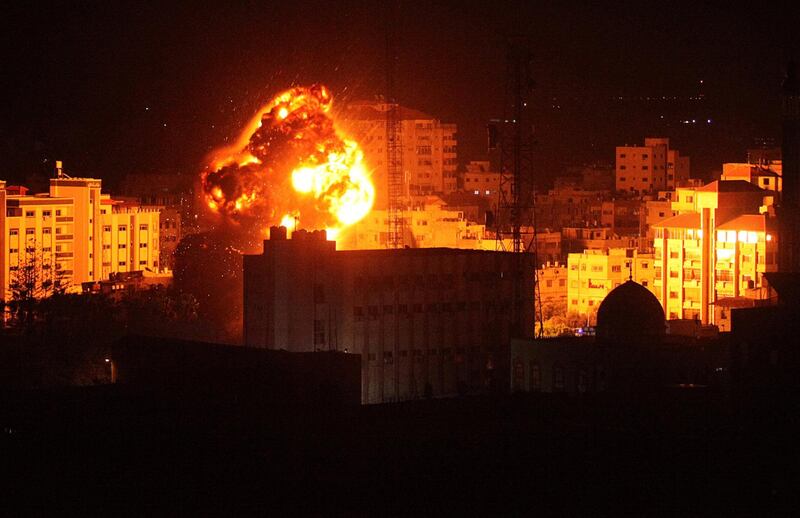 Flame and smoke are seen during an Israeli air strike in Gaza City. Reuters