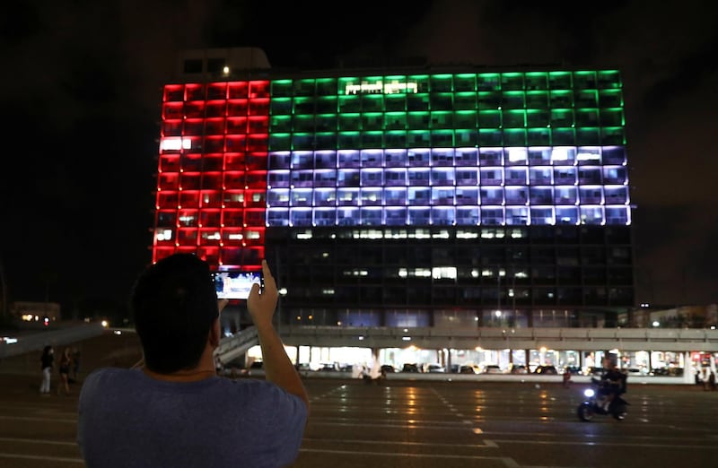 The city hall in the Israeli coastal city of Tel Aviv is lit up in the colours of the UAE national flag after the deal was announced.  Reuters