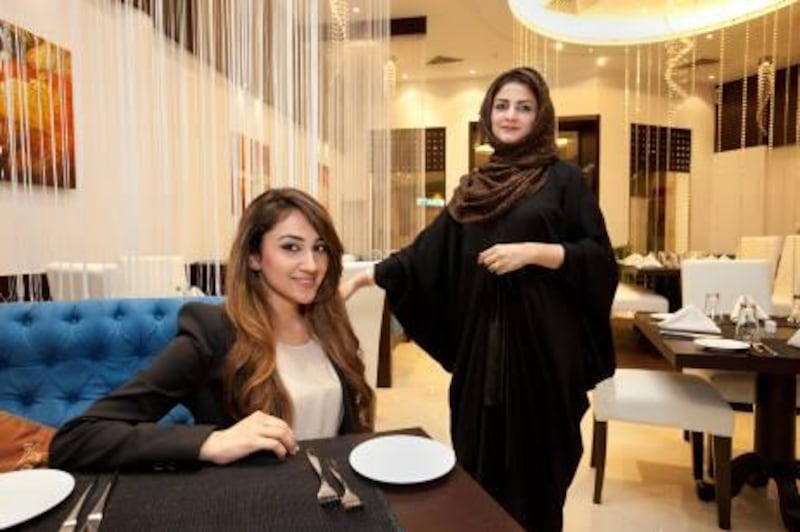 UAE - Dubai - May 03- 2011:   Ahlam Bolooki (left)  and her aunt Fahima Shaiban pose for a portrait at Sapne, an Indian restaurant at beach park plaza. ( Jaime Puebla - The National Newspaper )