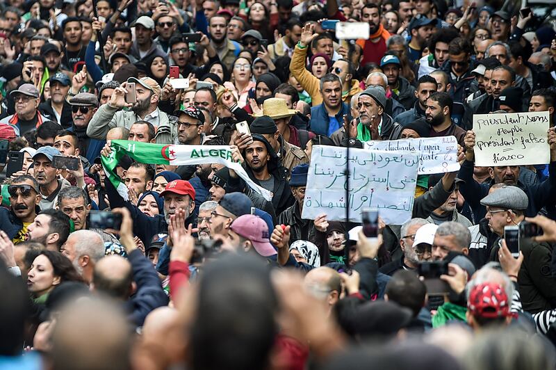 People gather for a mass anti-government demonstration in the centre of the Algerian capital Algiers. AFP