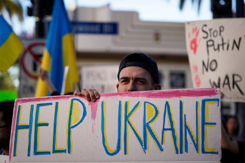 Dmytro Stasyshen of Ukraine holds a sign to protest the Russian invasion during a rally in the Hollywood area of Los Angeles. AP