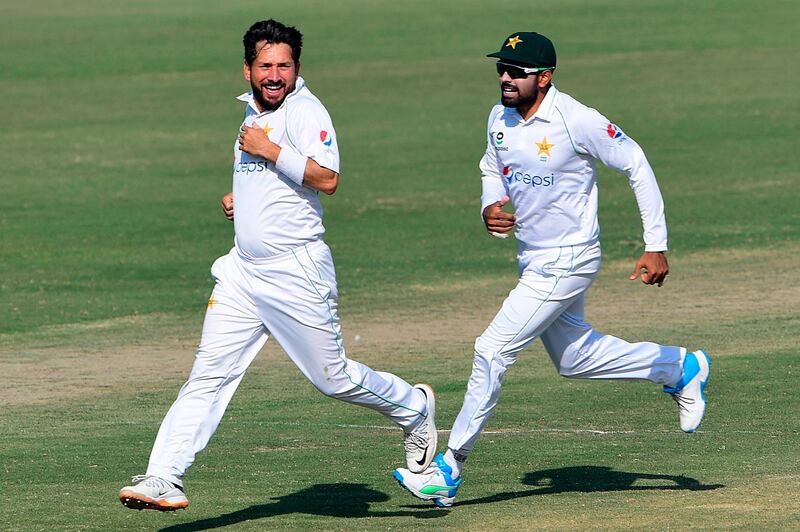 Pakistan's captain Babar Azam, right, and teammate Yasir Shah celebrate after the dismissal of South Africa's captain Quinton de Kock. AFP