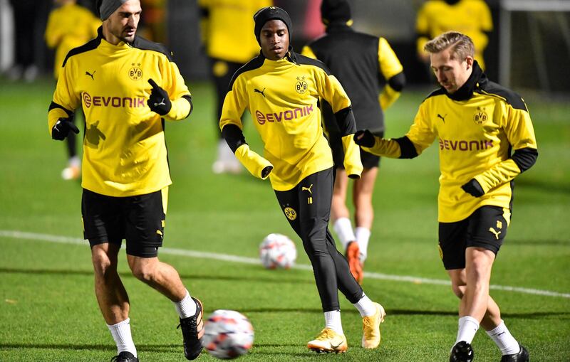 Left to right: Dortmund's Mats Hummels, Youssoufa Moukoko and Felix Passlack. AP