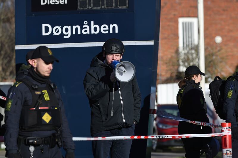 Far-right activist Rasmus Paludan speaks on a megaphone in front of a mosque in the Noerrebro area of Copenhagen, Denmark on Friday Jan.  27, 2023 where planned to burn the Quran.  Turkey has summoned the Danish ambassador over reports that an anti-Islam activist will be allowed to burn the Quran on Friday during a series of protests in Copenhagen.  (Olafur Steinar Gestsson / Ritzau Scanpix via AP)