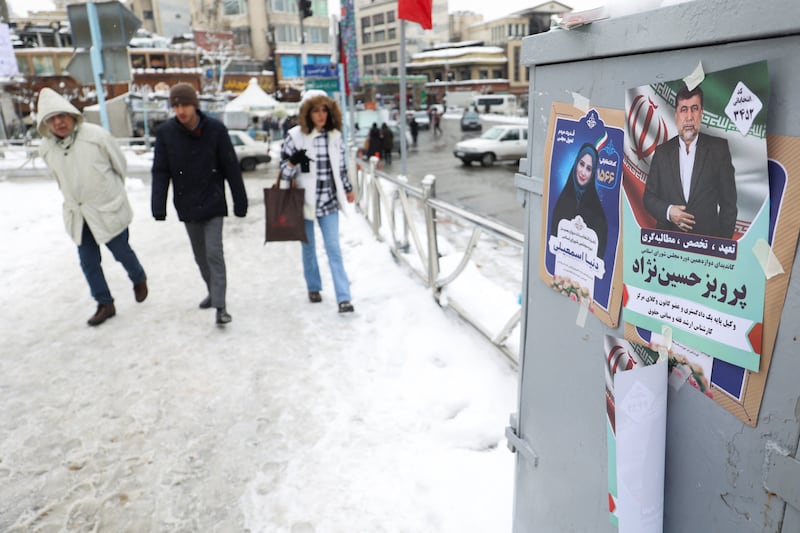 Candidates' posters during the last day of election campaigning, in Tehran. Reuters