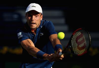 DUBAI, UNITED ARAB EMIRATES - FEBRUARY 26:  Roberto Bautista Agut of Spain in action against Florian Mayer of Germany during day one of the ATP Dubai Duty Free Tennis Championships at the Dubai Duty Free Stadium on February 26, 2018 in Dubai, United Arab Emirates.  (Photo by Francois Nel/Getty Images)