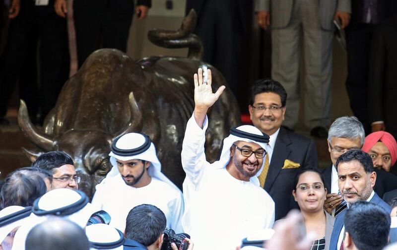 Sheikh Mohammed bin Zayed, Crown Prince of Abu Dhabi and Deputy Supreme Commander of the UAE Armed Forces, waves in front of a bull statue at the Bombay Stock Exchange (BSE) building, in Mumbai, India on February 12, 2016. Divyakant Solanki/EPA  