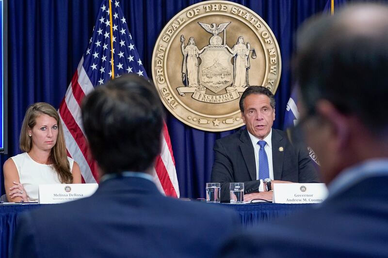 Melissa DeRosa, left, regularly appeared alongside New York Governor Andrew Cuomo during media briefings. AP