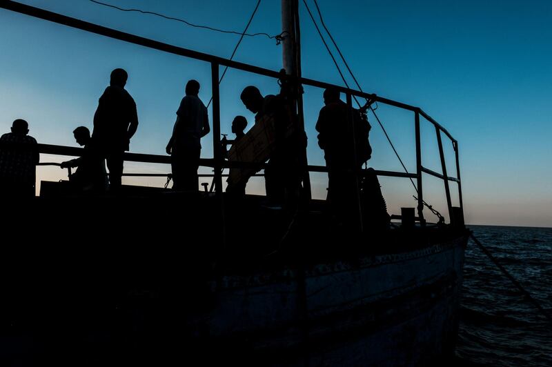 Workers stand aboard a boat in a dock at Tana Lake, in the city of Bahir Dar, Ethiopia. AFP