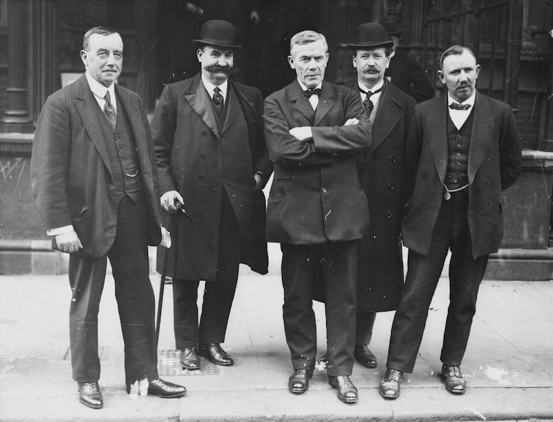 From left, Mr Henderson, William Brace, William Adamson, Vernon Hartshorn and James Henry Thomas outside Unity House during a coal workers' strike, in London, 1920