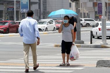 ABU DHABI, UNITED ARAB EMIRATES , June 1 – 2020 :- People wearing protective face mask as a preventive measure against the spread of coronavirus walking on the streets of Abu Dhabi. UAE government lifts the coronavirus restriction for the residents and businesses around the country. (Pawan Singh / The National) For News/Stock