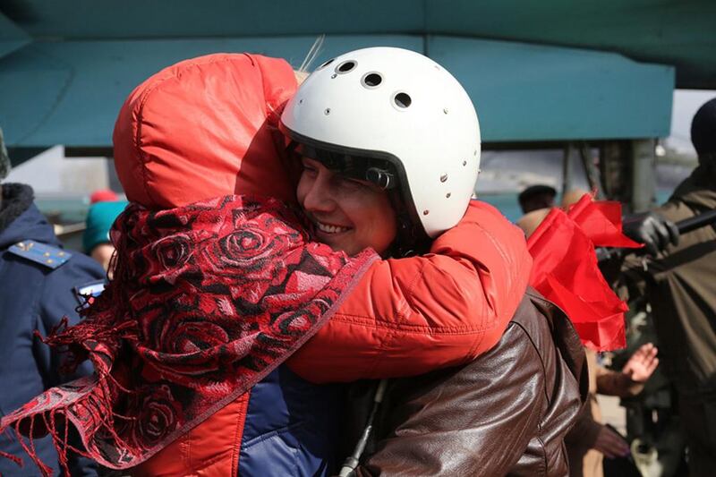 A Russian Su-34 bomber pilot being welcomed upon arrival from the Syrian Hmeymim airbase to a Russian airbase in the Voronezh region on March 15, 2016. The first group of Russian warplanes left the Hmeymim airbase for permanent location airfields in Russia. Olga Balashove/Russian defence ministry handout via EPA 