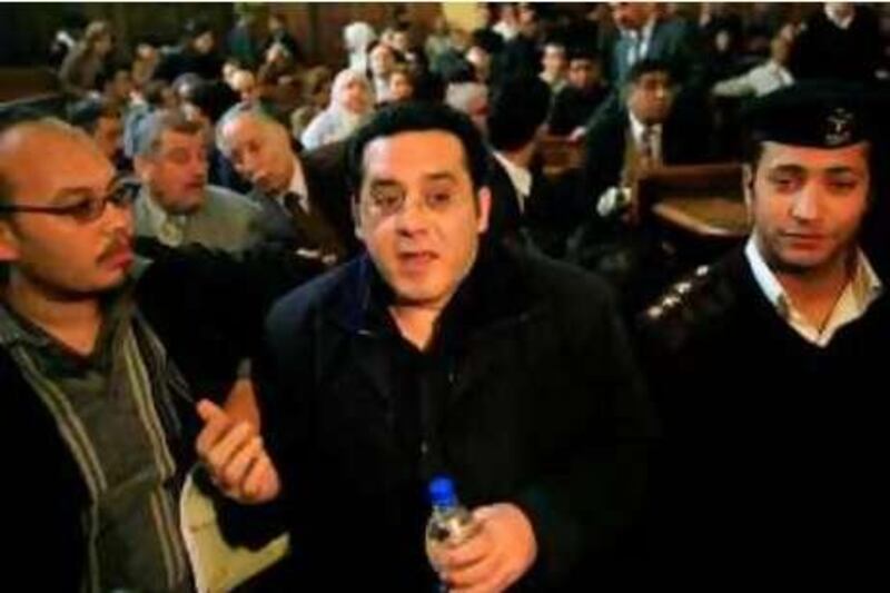 Egyptian former presidential elections candidate Ayman Nur (C) arrives under police escort to the high court in Cairo on  March, 10 2008. A verdict was expected in the latest appeal of the jailed opposition leader, to be released on medical grounds. AFP POTO/KHALED DESOUKI
