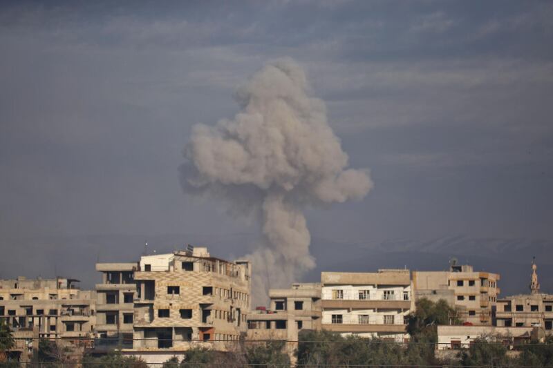 Smoke rises from buildings in Kafr Batna.  Amer Almohibany / AFP Photo