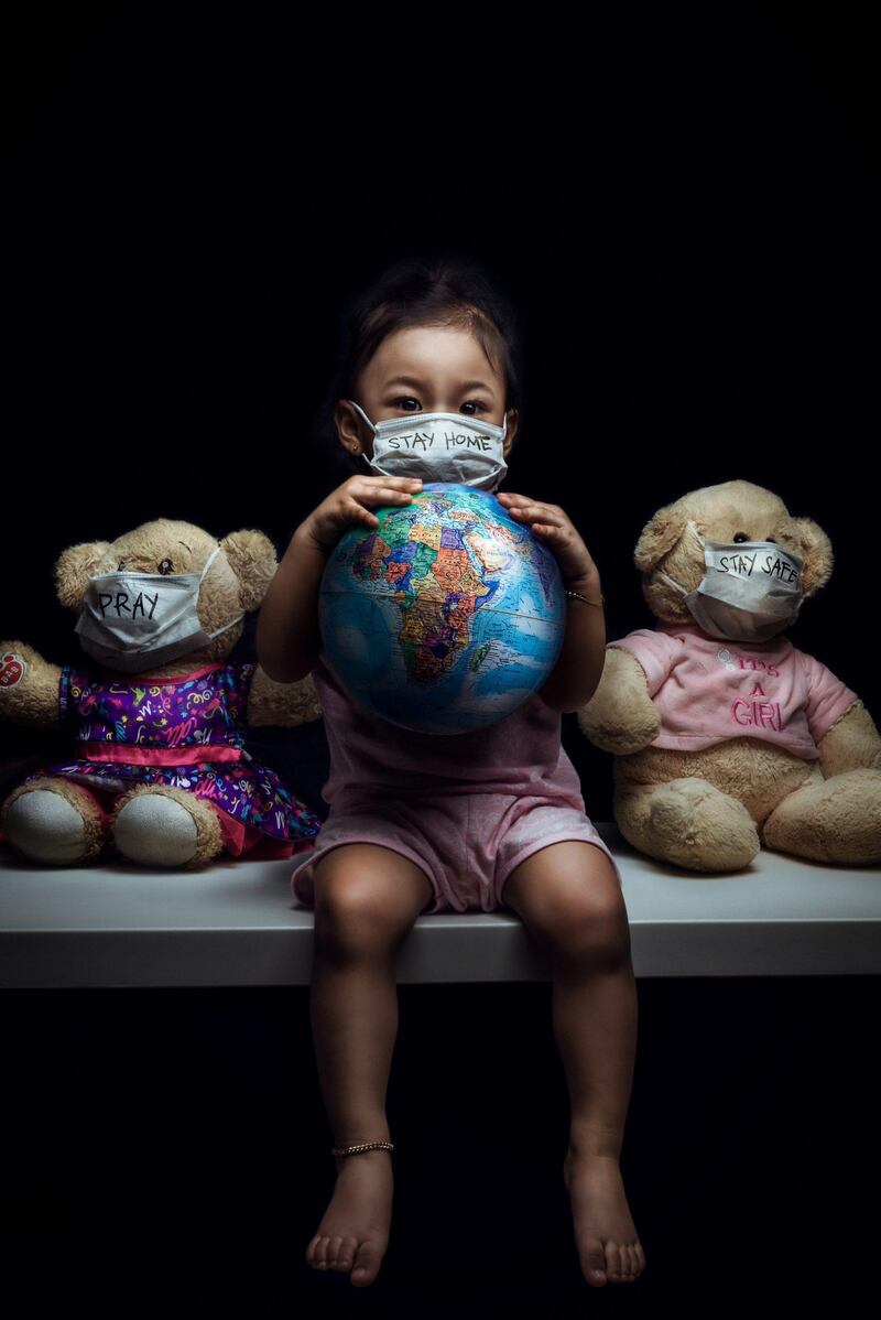 Photographer Andy Ramos was shortlisted in week two for this image, 'Pray, Stay At Home, Stay Safe', depicting a young girl and her toys wearing facemasks. Andy Ramos