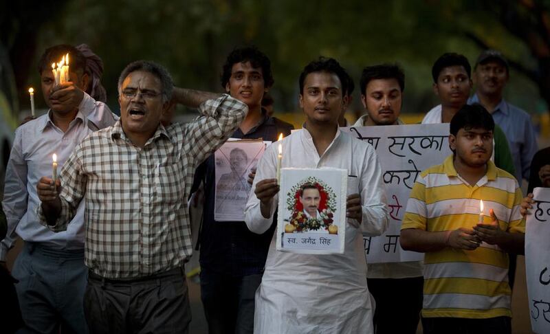 Indian journalists hold a candlelight vigil in memory of freelance journalist Jagendra Singh in New Delhi on June 12, 2015. Singh was attacked and set on fire after accusing a state minister of illegal activities. Saurabh Das / AP Photo