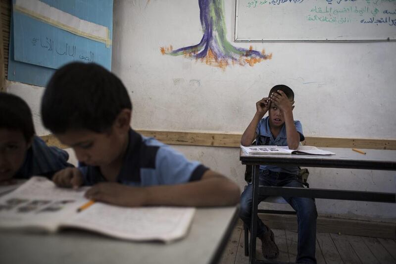 Pupils take part in a classroom activity.