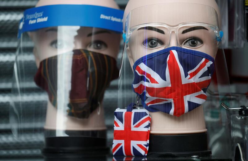 A Union Jack design face mask is seen for sale in the window of a shop in Manchester, Britain. Reuters
