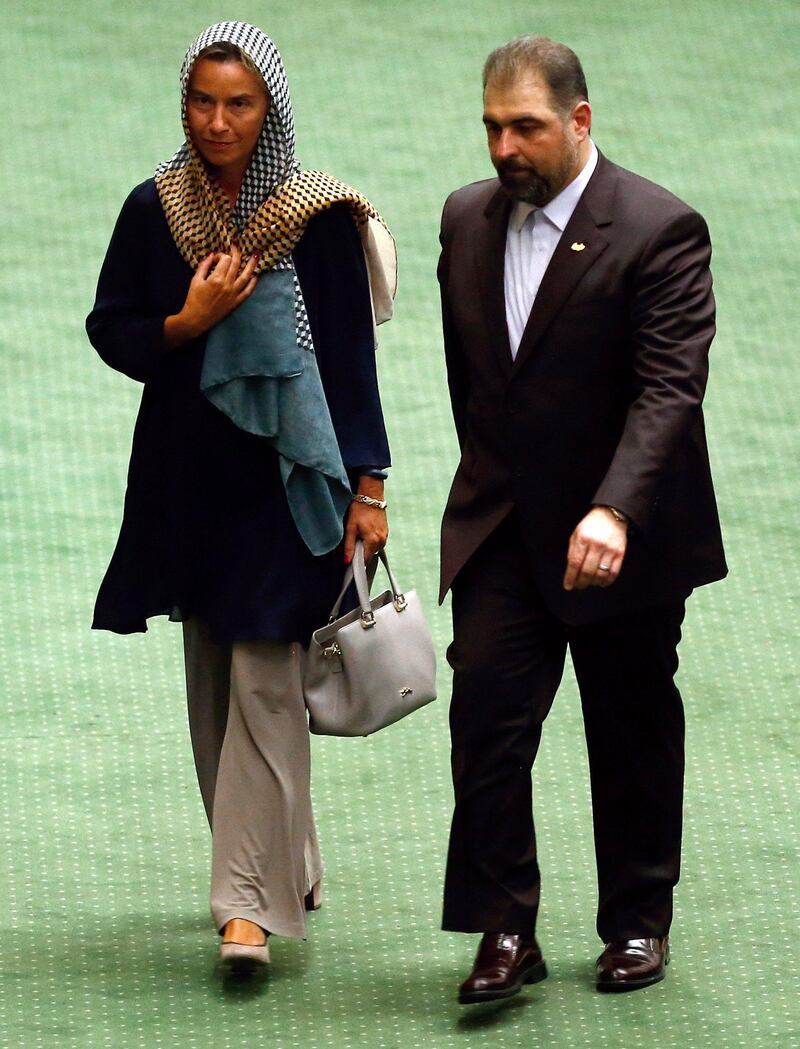 EU foreign policy chief Federica Mogherini, left, arrives to attend the Iranian parliament before Hassan Rouhani was sworn-in for his second four-year term of presidency at the parliament in Tehran, Iran. EPA