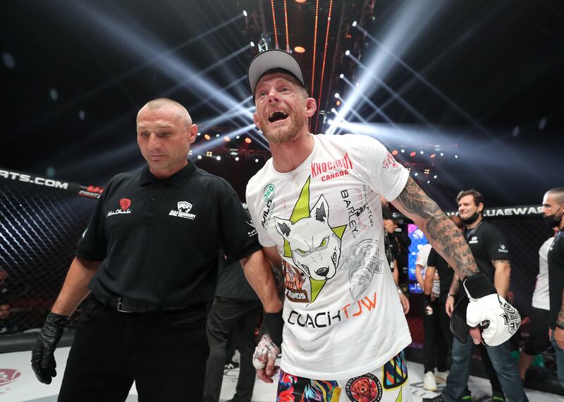 Jesse Arnett celebrates his victory against Ali Al Qaisi in the featherweight title fight at UAE Warriors 30.