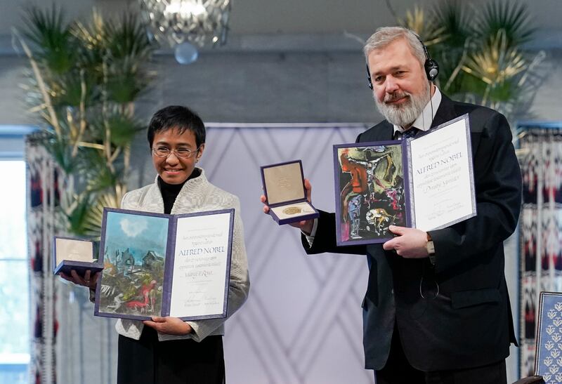 2021. Nobel Peace Prize winners Maria Ressa (L) and Dmitry Muratov receive their awards during the ceremony at the City Hall in Oslo. Ms Ressa, from the Philippines, and Mr Muratov, from Russia, were awarded the Nobel Peace Prize for their efforts for freedom of expression. EPA