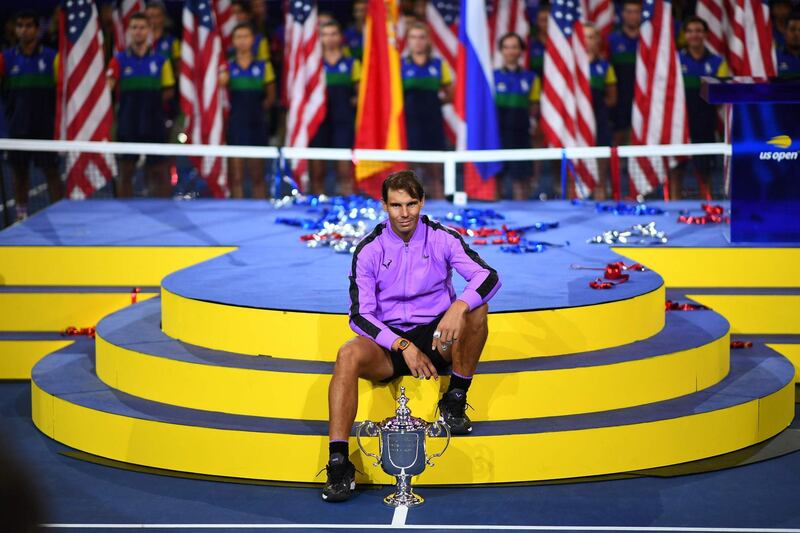 TOPSHOT - Rafael Nadal of Spain pose with the trophy after his win over Daniil Medvedev of Russia during the men's Singles Finals match at the 2019 US Open at the USTA Billie Jean King National Tennis Center in New York on September 8, 2019. Rafael Nadal captured his 19th career Grand Slam title in thrilling fashion on Sunday by winning the US Open final, outlasting Russia's Daniil Medvedev 7-5, 6-3, 5-7, 4-6, 6-4 to seize his fourth crown in New York. / AFP / Johannes EISELE
