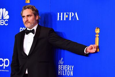 US actor Joaquin Phoenix poses in the press room after winning the award for Best Performance by an Actor in a Motion Picture - Drama during the 77th annual Golden Globe Awards on January 5, 2020, at The Beverly Hilton hotel in Beverly Hills, California. / AFP / FREDERIC J. BROWN
