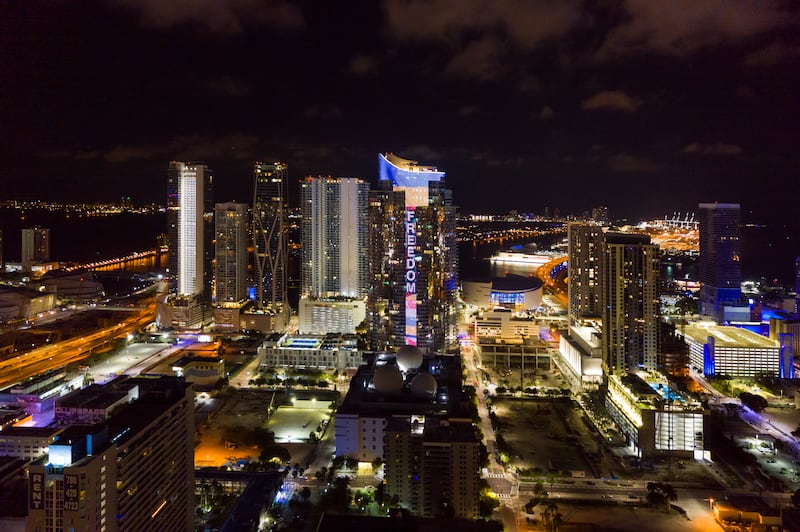 The Paramount Miami Worldcentre skyscraper in Florida lights up blue and yellow. Paramount Miami Worldcentre via AP