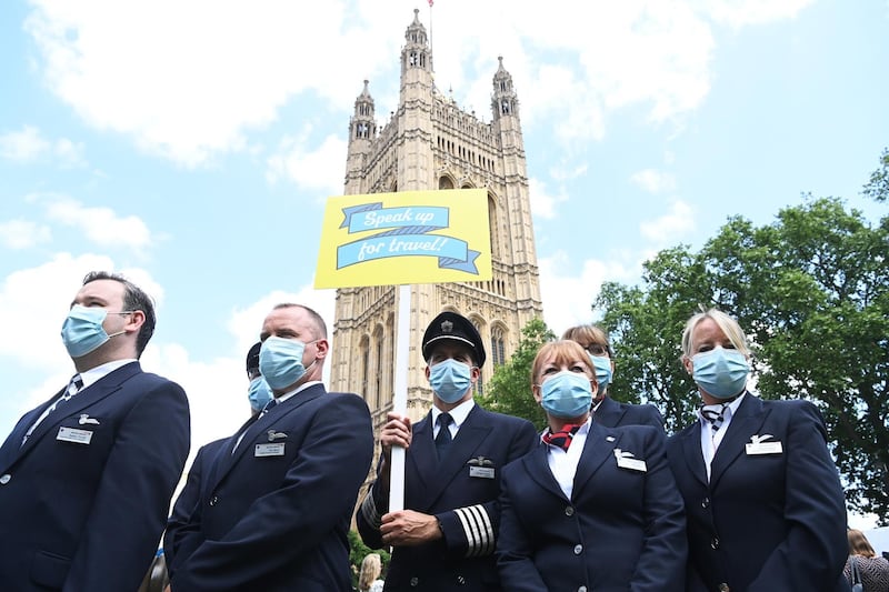 Representatives from the travel industry attend a demonstration during a 'Travel Day of Action' outside the Houses of Parliament, in London. EPA