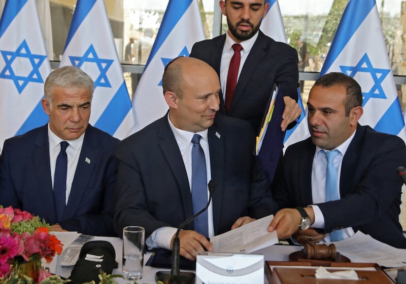 Israeli Foreign Minister Yair Lapid, Prime Minister Nafrali Bennet and politician and Knesset member Abir Kara attend a weekly cabinet meeting in Jerusalem.  Reuters
