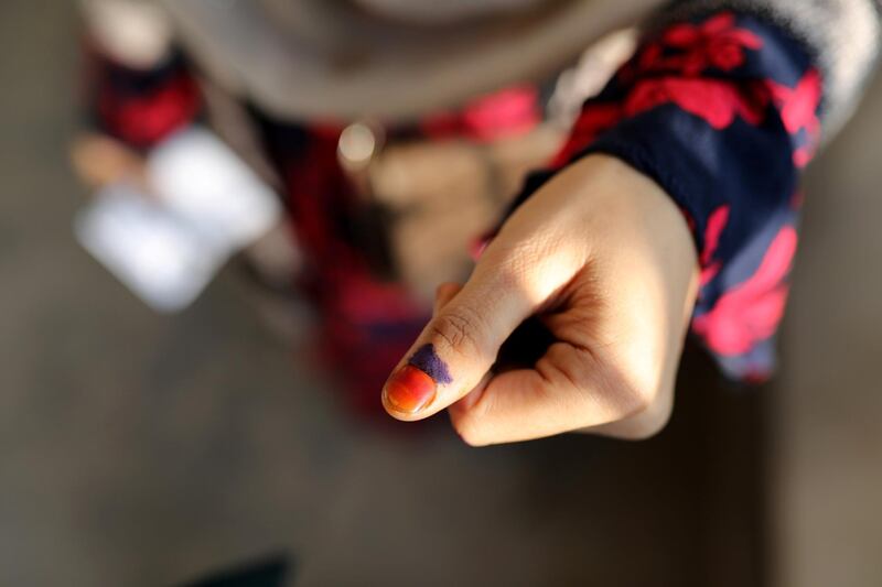 A woman displays her inked thumb in Dhaka. Reuters