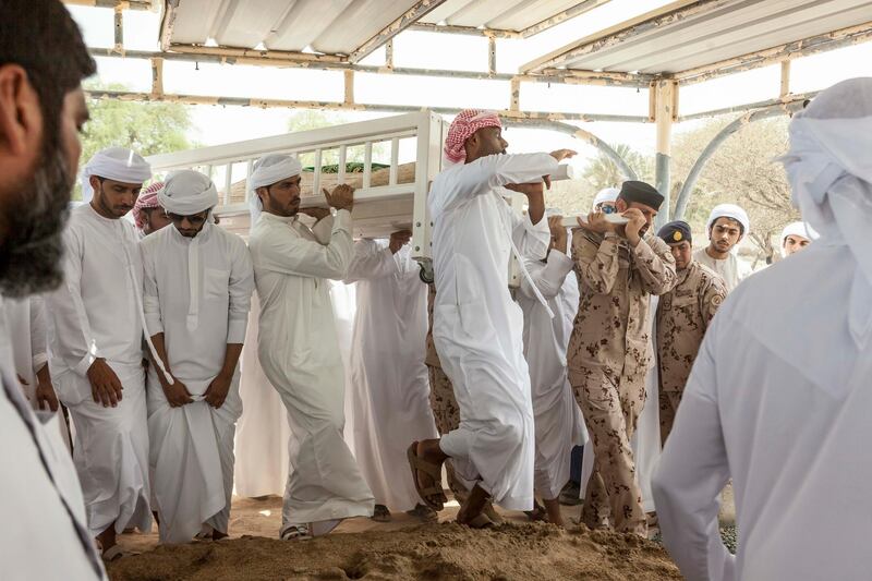 FUJEIRAH, UNITED ARAB EMIRATES, 19 JUNE 2017. The funeral of Emirati Athlete Abdullah Hayayei in Qidfa that died from an accident in London while training. Family and commmunity members lay Abdullah's body to rest at the cemetery in Qidfa. (Photo: Antonie Robertson/The National) Journalist: Ruba Haza. Section: National.