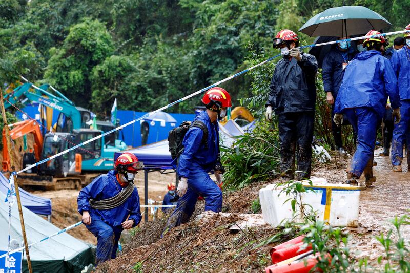 Rescue workers at the site where a China Eastern Airlines Boeing 737-800 crashed in March. Reuters