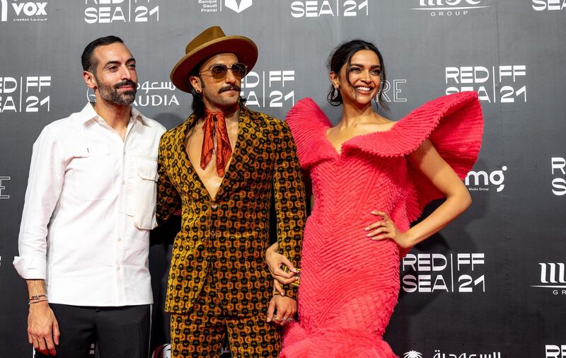 Bollywood stars Ranveer Singh and Deepika Padukone with the Red Sea International Film Festival chairman Mohammed Al Turki, left, at the world premiere of their film '83' in Jeddah. Photo: Red Sea International Film Festival