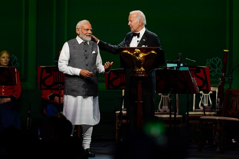 President Joe Biden talks with India's Prime Minister Narendra Modi at a state dinner at the White House in Washington. AP