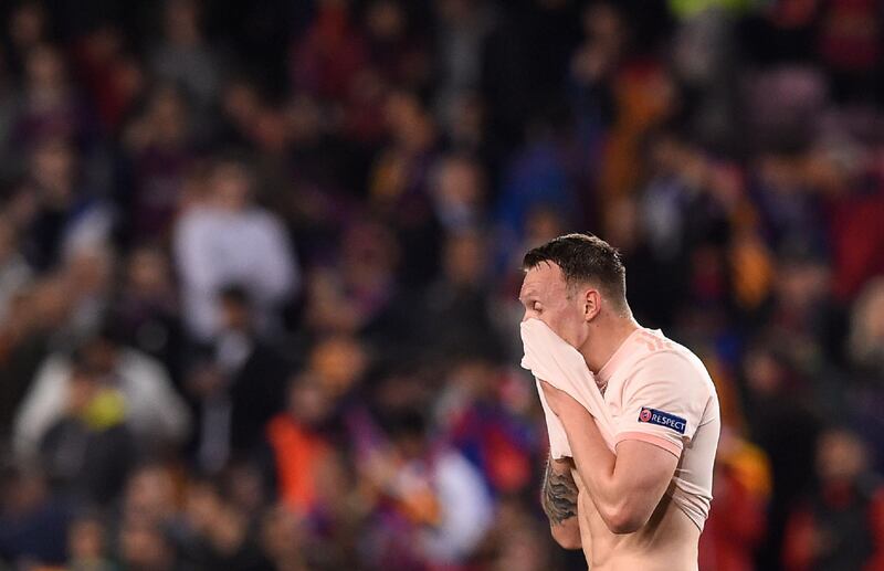 Manchester United's English defender Phil Jones leaves after the UEFA Champions League quarter-final second leg football match between Barcelona and Manchester United at the Camp Nou stadium in Barcelona on April 16, 2019. / AFP / Josep LAGO
