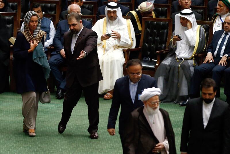 EU foreign policy chief Federica Mogherini, left, arrives to attend the Iranian parliament. EPA