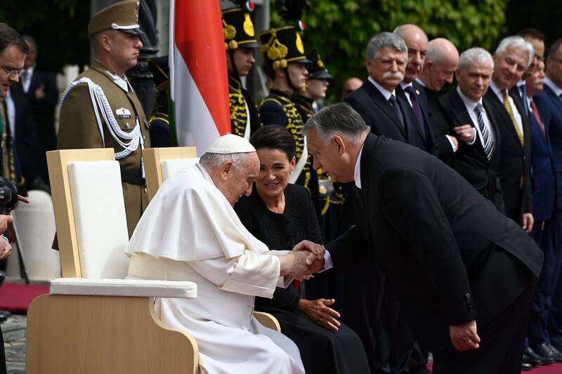 Pope Francis shakes hands with Hungary's Prime Minister Viktor Orban at the start of his visit in Budapest. EPA