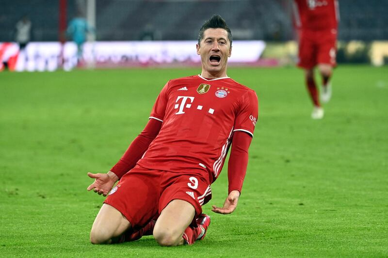 Bayern's Robert Lewandowski celebrates scoring his side's fourth goal against Borussia Dortmund. AP