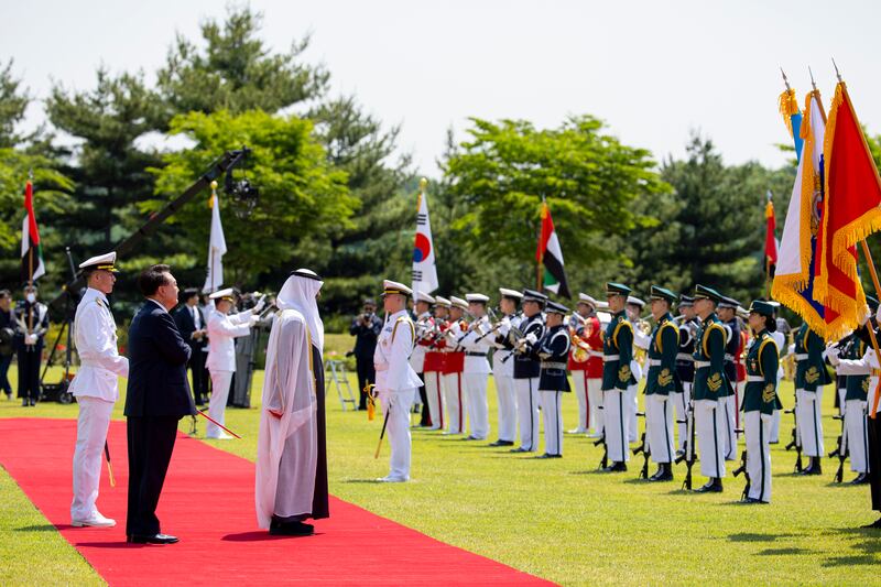 Sheikh Mohamed and Mr Yoon inspect the guard of honour. 
Ryan Carter / UAE Presidential Court 