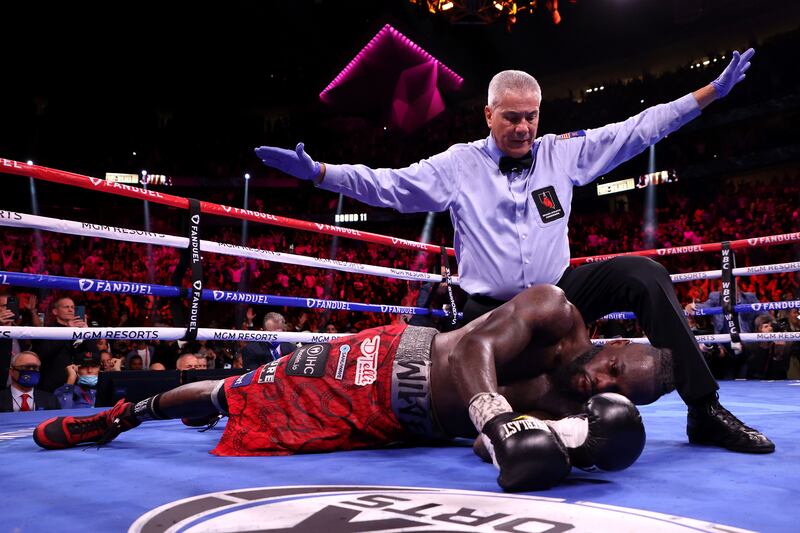 LAS VEGAS, NEVADA - OCTOBER 09: Referee Russell Mora calls the fight after Tyson Fury knocked out Deontay Wilder in the 11th round during their WBC heavyweight title fight at T-Mobile Arena on October 09, 2021 in Las Vegas, Nevada.    Al Bello / Getty Images / AFP
