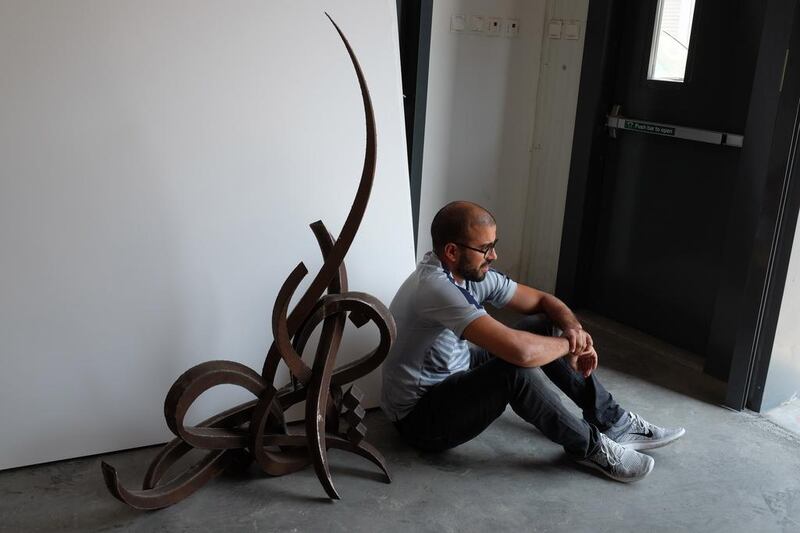 Looking pensive. eL Seed in his new permanent studio in Alserkal Avenue in Dubai. Photos by Sueraya Shaheen
