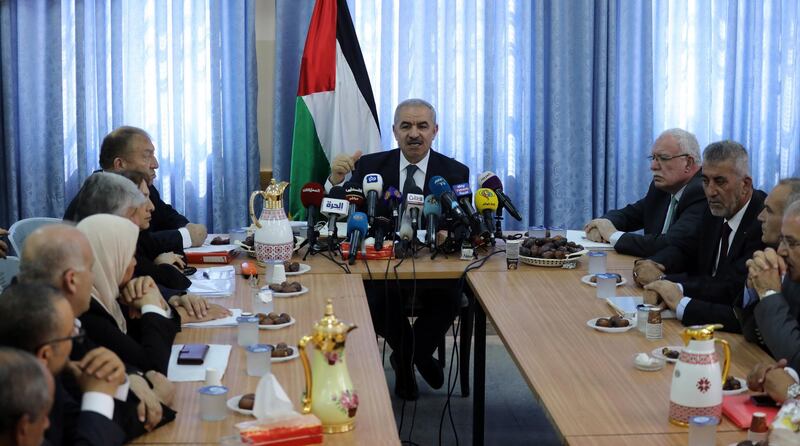 Palestinian Prime Minister Mohammad Ashtiyeh speaks during the weekly government meeting in the West Bank village of Fasayel, in the Jordan Valley. EPA