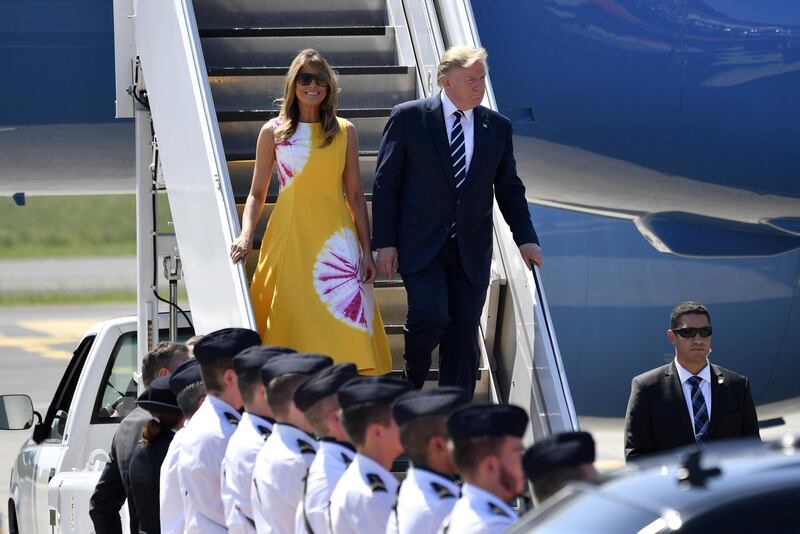 US President Donald Trump with wife and US First Lady Melania Trump as they disembark from an airplane upon landing at the Biarritz Pays Basque Airport in Biarritz on the opening day of the G7 summit in France. EPA