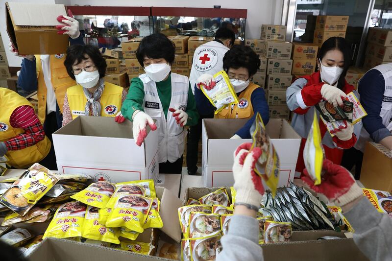 Red Cross workers prepare emergency relief kits in Seoul, South Korea. Getty Images