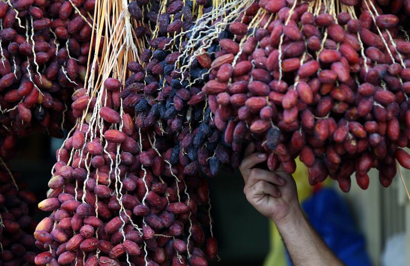 Dates are displayed for sale on the eve of Islam's holy fasting month of Ramadan in the West Bank city of Jericho on July 31, 2011. AFP PHOTO/ABBAS MOMANI
 *** Local Caption ***  530247-01-08.jpg