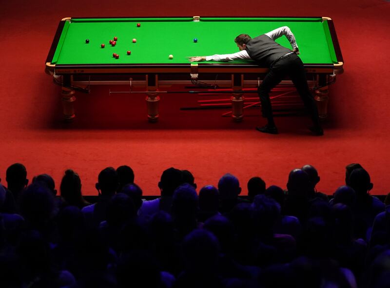 England's Mark Selby plays a shot during the Betfred World Snooker Championship at the Crucible Theatre in Sheffield, England. The tournament is being played in front of spectators as part of trials to see how events can reopen as Covid-19 restrictions ease. Getty Images