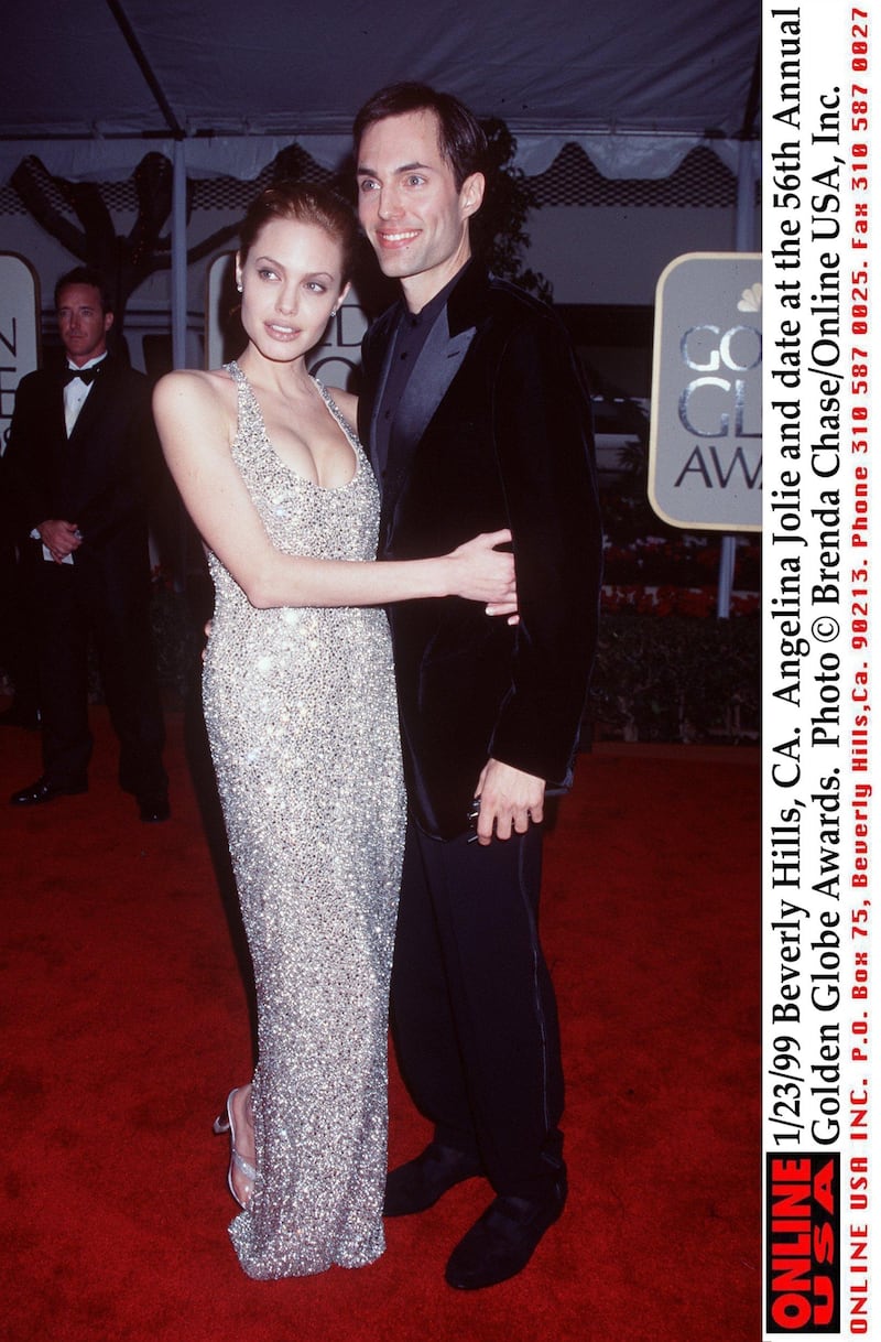 1/23/99 Beverly Hills, CA. Angelina Jolie and date at the 56th Annual Golden Globe Awards.