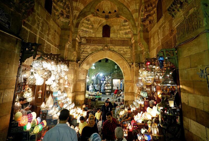 People walk at a popular tourist area named "Khan el-Khalili" in the al-Hussein and Al-Azhar districts in old Islamic Cairo, Egypt, July 4, 2019. REUTERS/Mohamed Abd El Ghany